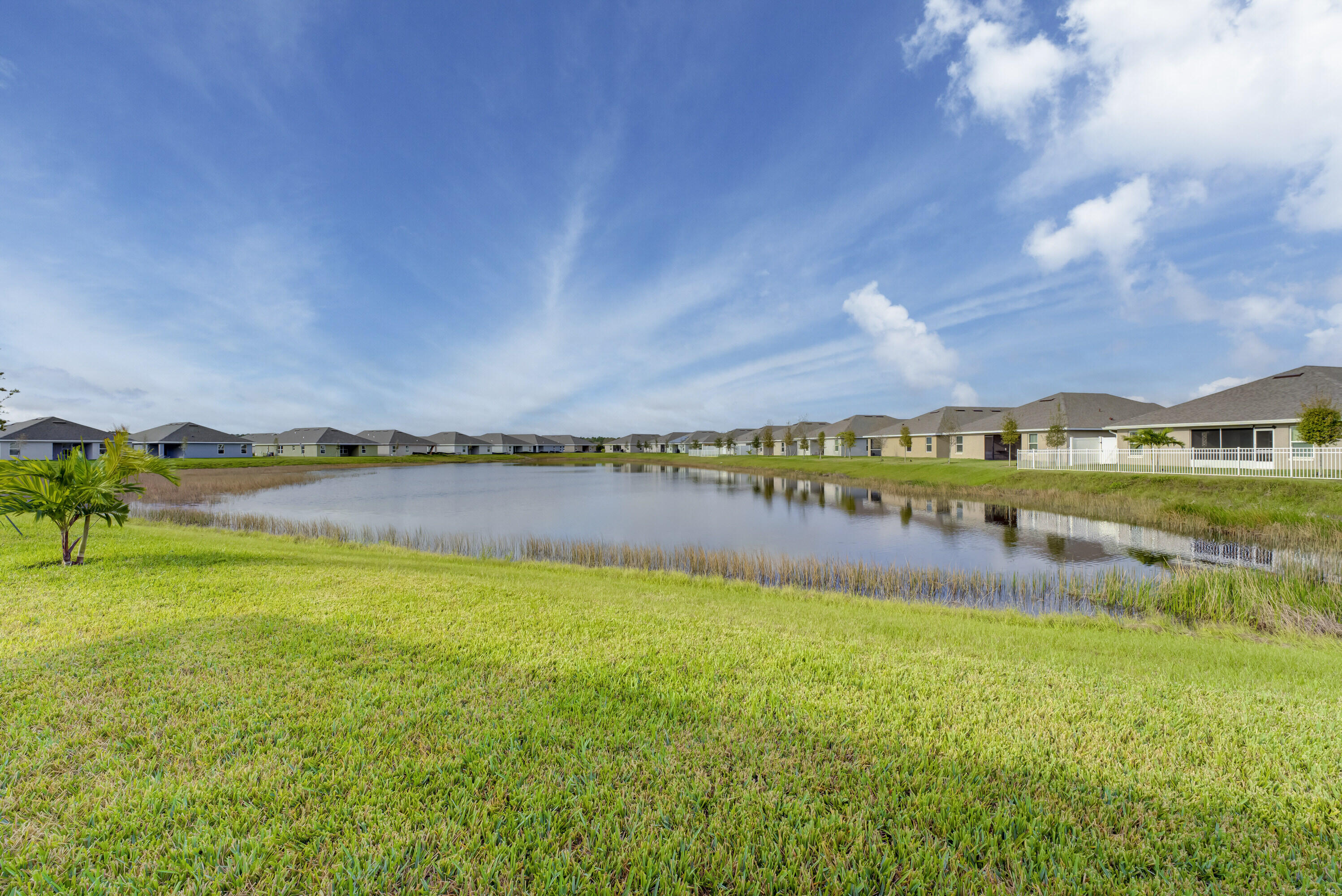 5327 Vespera Street Fort Pierce, FL 34951 - Photo 24 of 27 a view of a lake with a big yard
