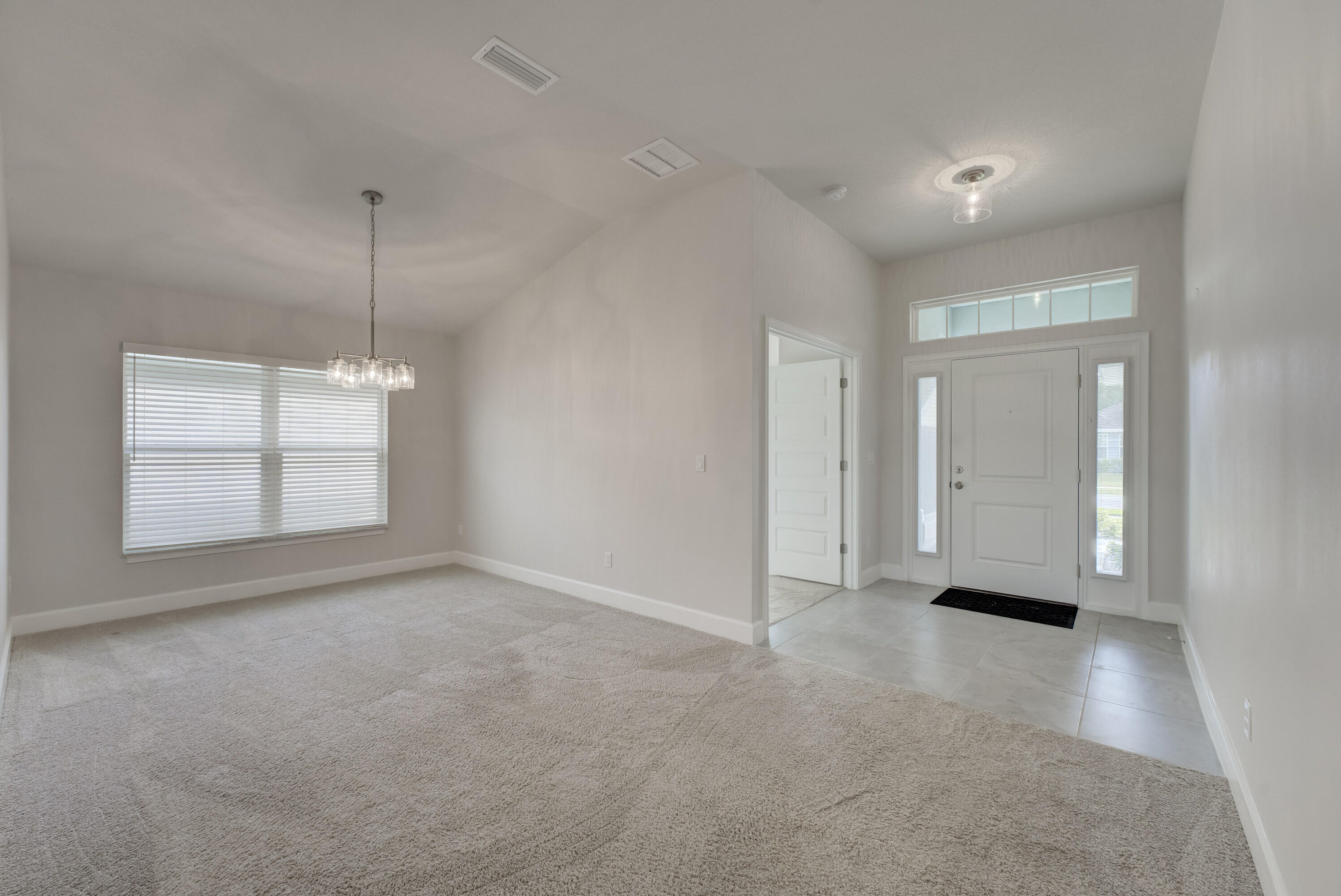 5327 Vespera Street Fort Pierce, FL 34951 - Photo 4 of 27 a view of an empty room with a window