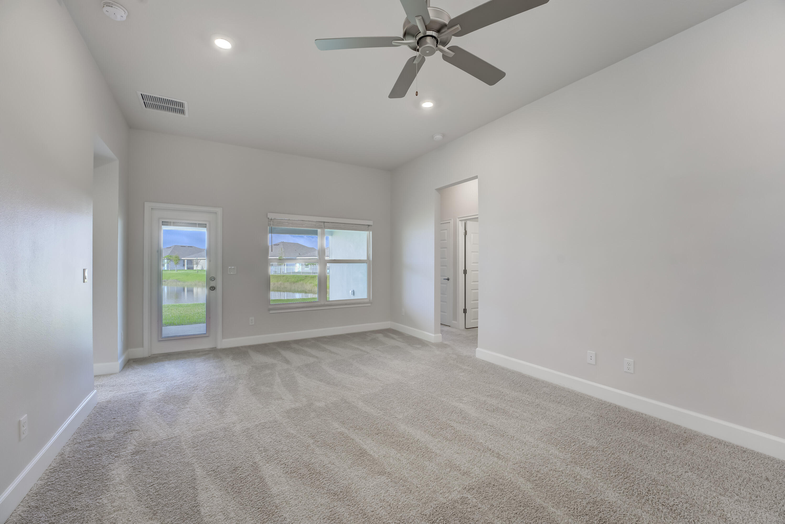 5327 Vespera Street Fort Pierce, FL 34951 - Photo 6 of 27 an empty room with windows and closet