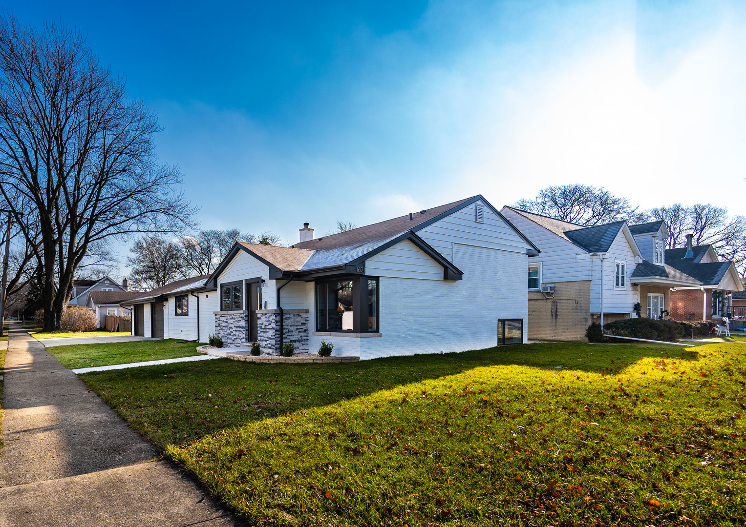 1621 South Grace Avenue Park Ridge, IL 60068 - Photo 2 of 29 a front view of a house with a yard