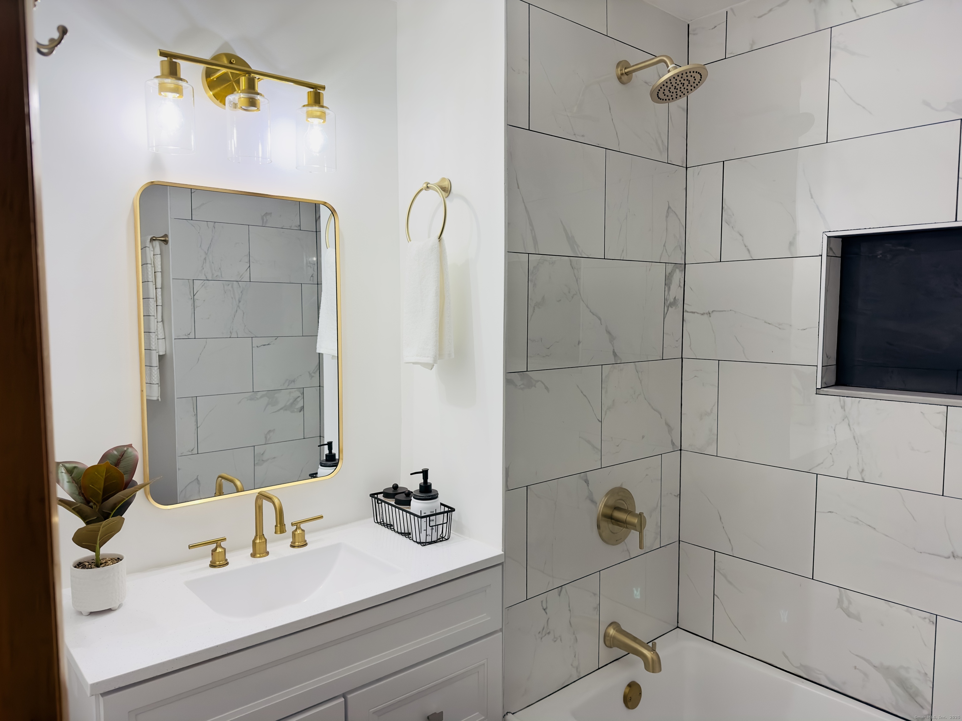 64 White Deer Rocks Road, Unit 5E Woodbury, CT 06798 - Photo 8 of 9 a bathroom with a sink and a mirror