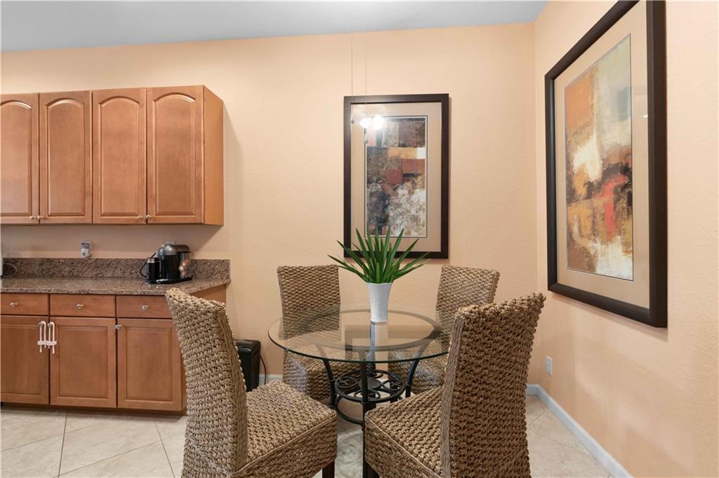 163 Southwest Walking Path Stuart, FL 34997 - Photo 13 of 37 a view of a dining room with furniture and window