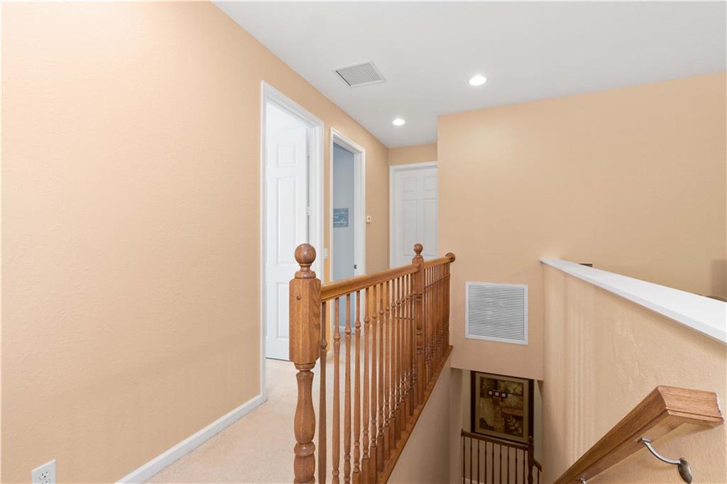 163 Southwest Walking Path Stuart, FL 34997 - Photo 20 of 37 a view of a hallway with windows