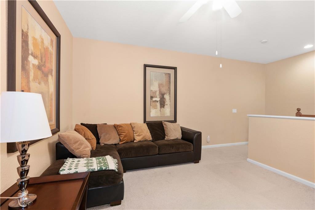 163 Southwest Walking Path Stuart, FL 34997 - Photo 28 of 37 a living room with furniture and a couch