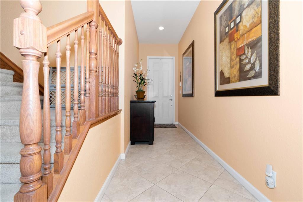 163 Southwest Walking Path Stuart, FL 34997 - Photo 34 of 37 a view of a hallway with stairs