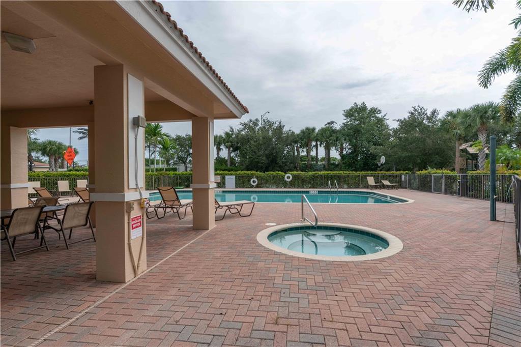 163 Southwest Walking Path Stuart, FL 34997 - Photo 35 of 37 a view of a swimming pool with a patio