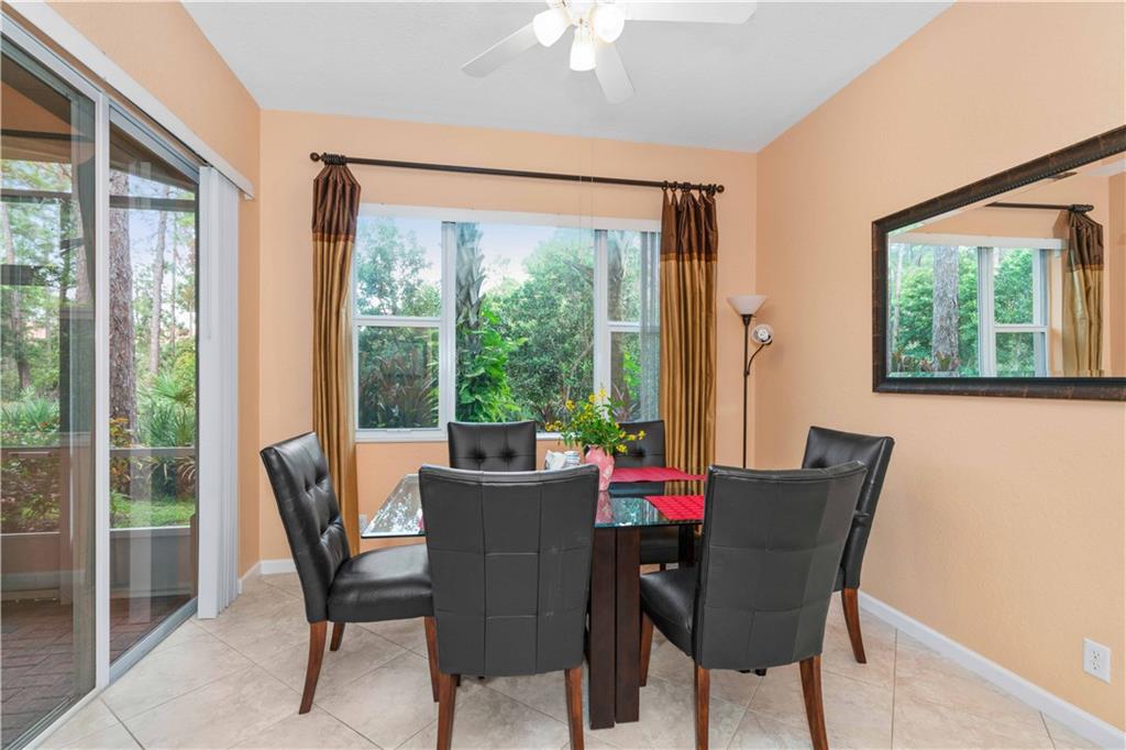 163 Southwest Walking Path Stuart, FL 34997 - Photo 6 of 37 a view of a dining room with furniture window and outside view