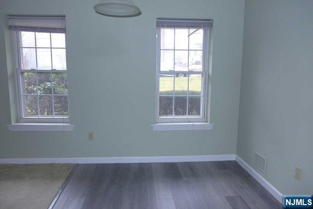 350 Maple Avenue, Unit 1 Oradell, NJ 07649 - Photo 6 of 9 an empty room with wooden floor and windows
