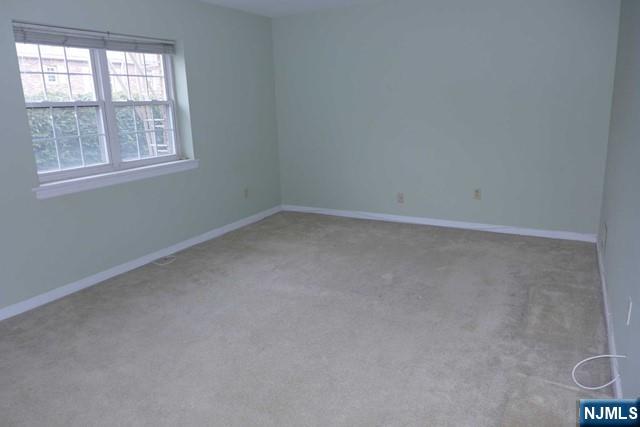 350 Maple Avenue, Unit 1 Oradell, NJ 07649 - Photo 7 of 9 an empty room with a window