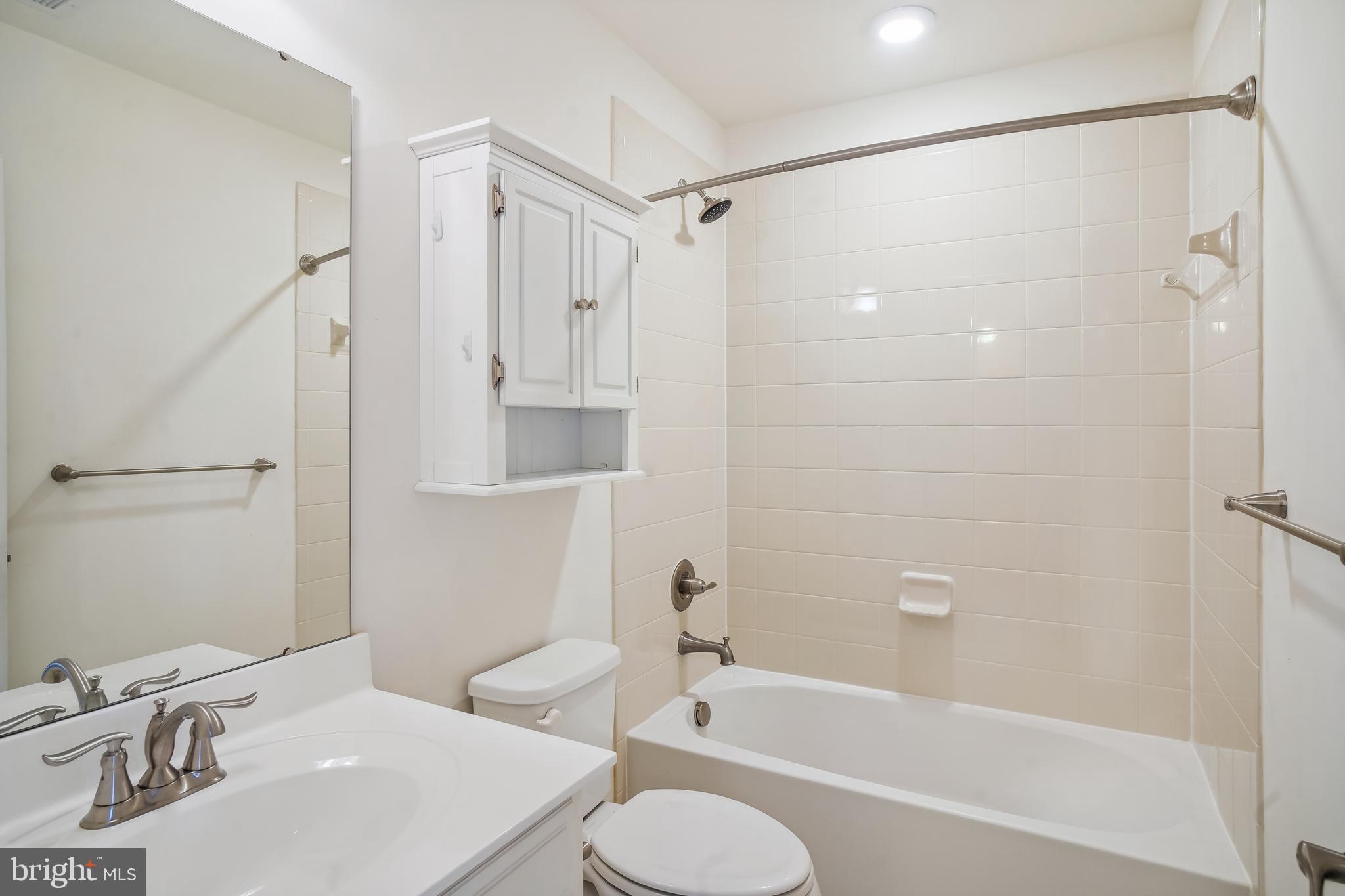 5934 Jefferson Commons Way Frederick, MD 21703 - Photo 19 of 27 a bathroom with a sink toilet and shower
