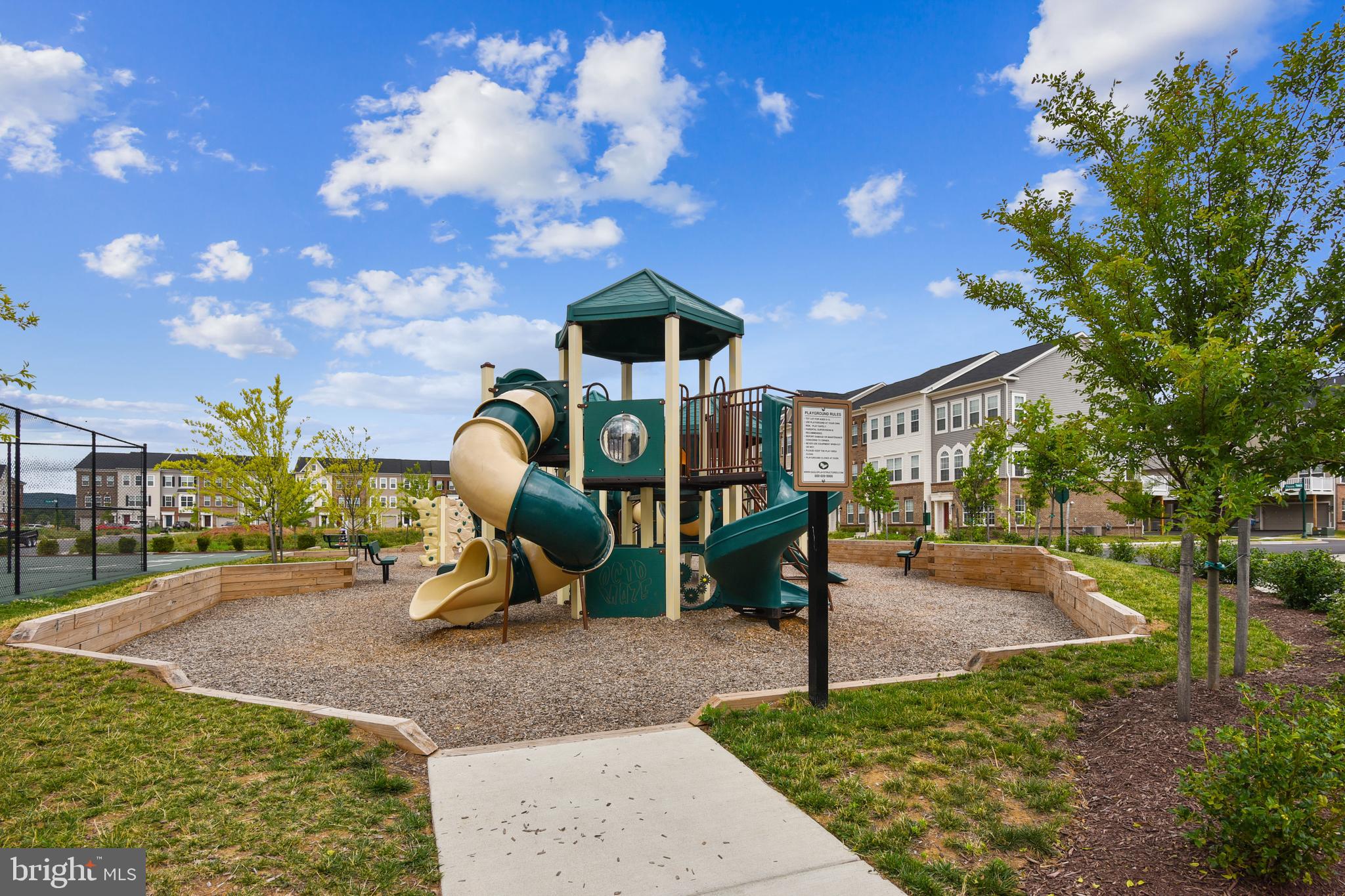 5934 Jefferson Commons Way Frederick, MD 21703 - Photo 23 of 27 a childrens park with lots of swings and slides