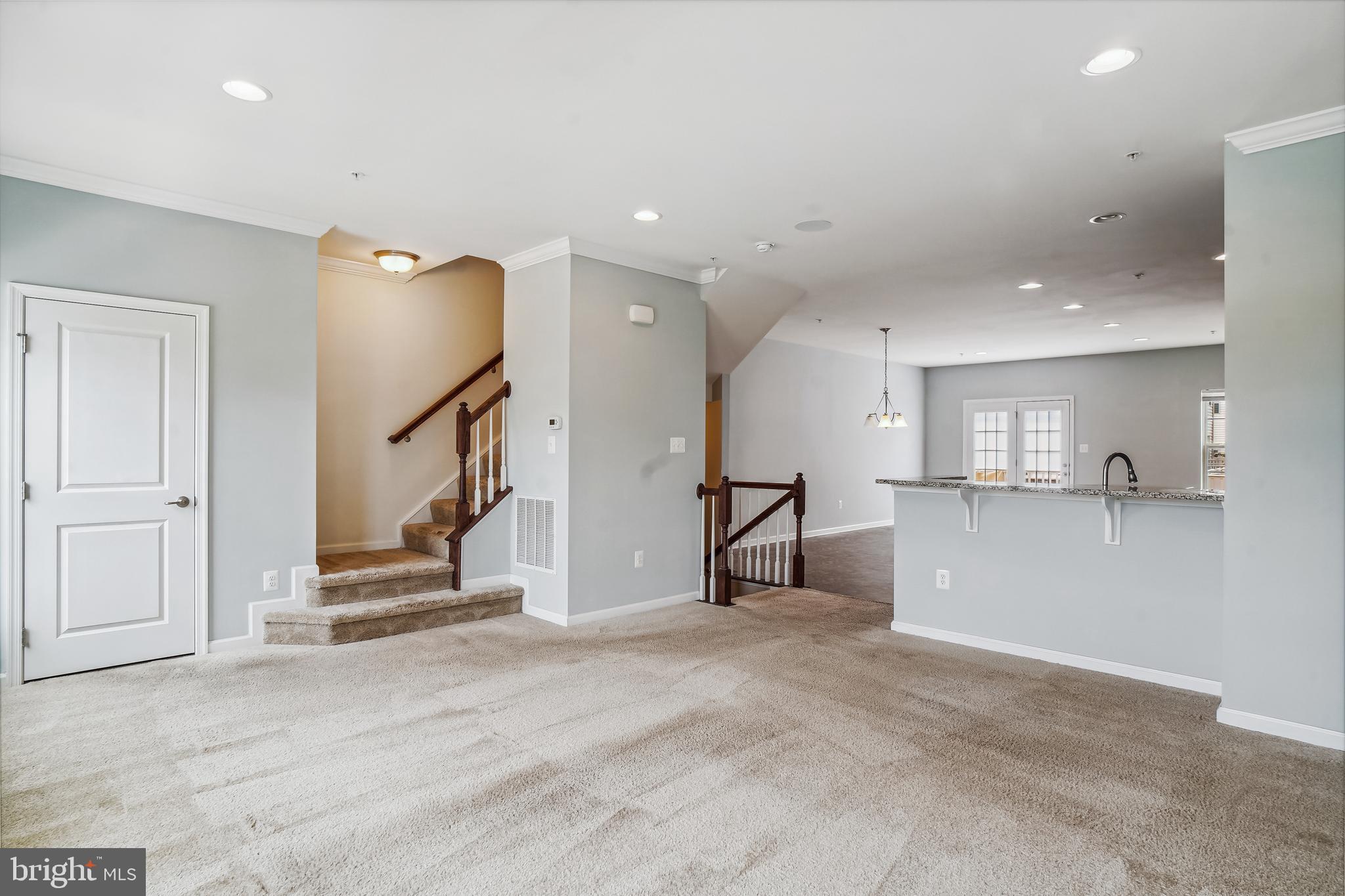 5934 Jefferson Commons Way Frederick, MD 21703 - Photo 5 of 27 a view of a livingroom with a staircase