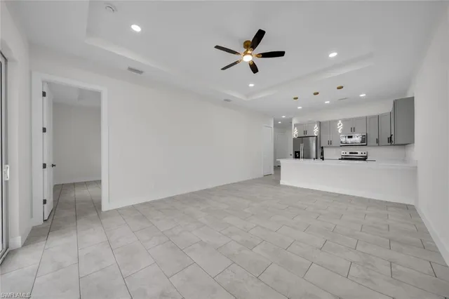 a view of a kitchen with a sink and a window
