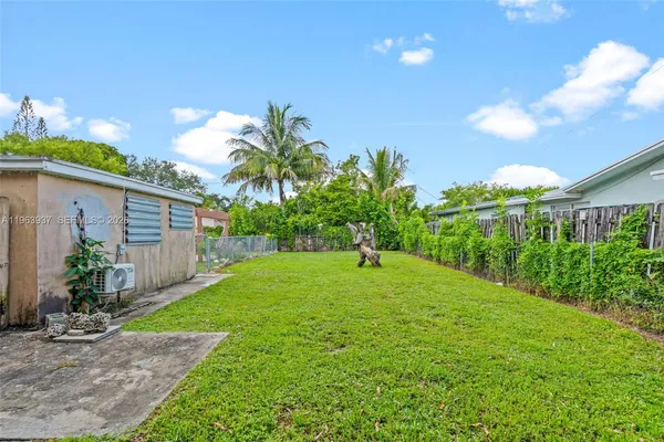 a view of a back yard of the house