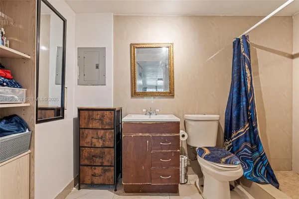 a bathroom with a toilet a sink and a bathtub
