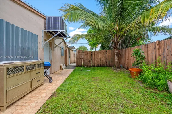 a backyard of a house with seating space