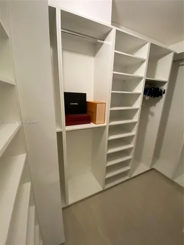 a view of an empty room with stairs