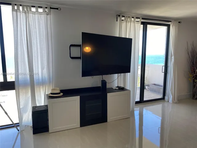 a kitchen with stainless steel appliances a refrigerator sink and cabinets