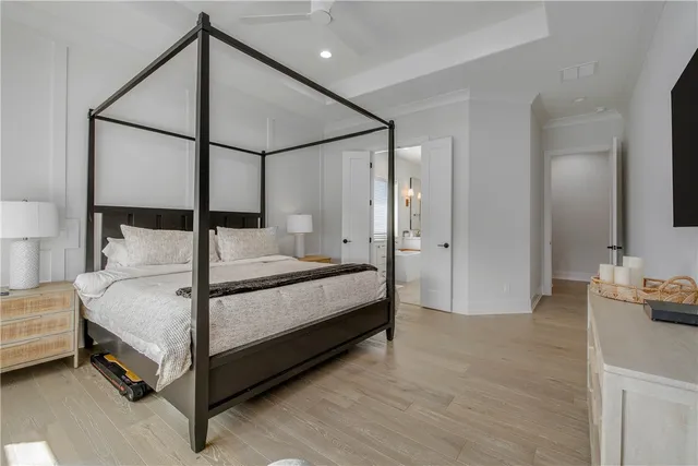 a bedroom with a bed and a table