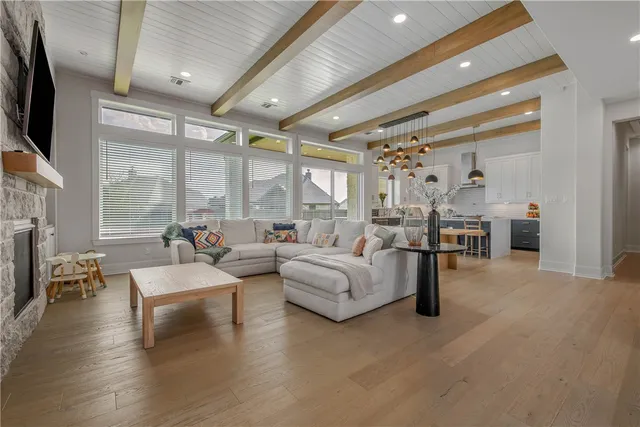 a living room with fireplace furniture and a flat screen tv