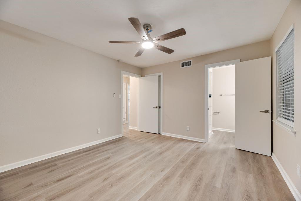 5706 Rocky Ridge Road Dallas, TX 75241 - Photo 16 of 31 a view of an empty room with wooden floor