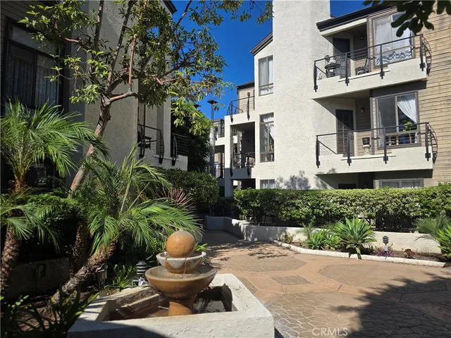 a house with lots of trees in the background