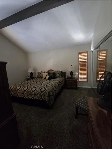 a bed room with furniture and a window