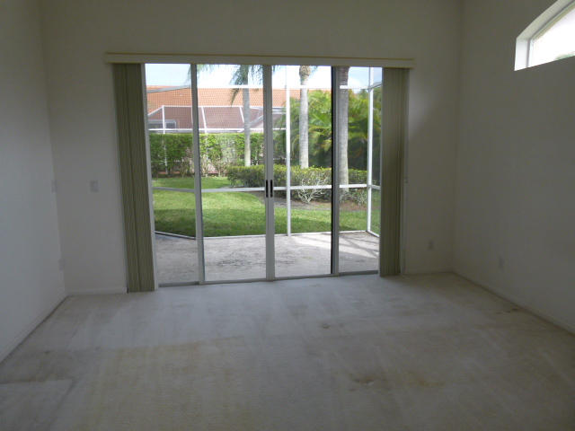7901 Dorchester Road Boynton Beach, FL 33472 - Photo 12 of 14 a view of empty room with front door