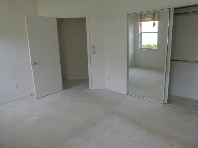 7901 Dorchester Road Boynton Beach, FL 33472 - Photo 9 of 14 a view of an empty room with a window