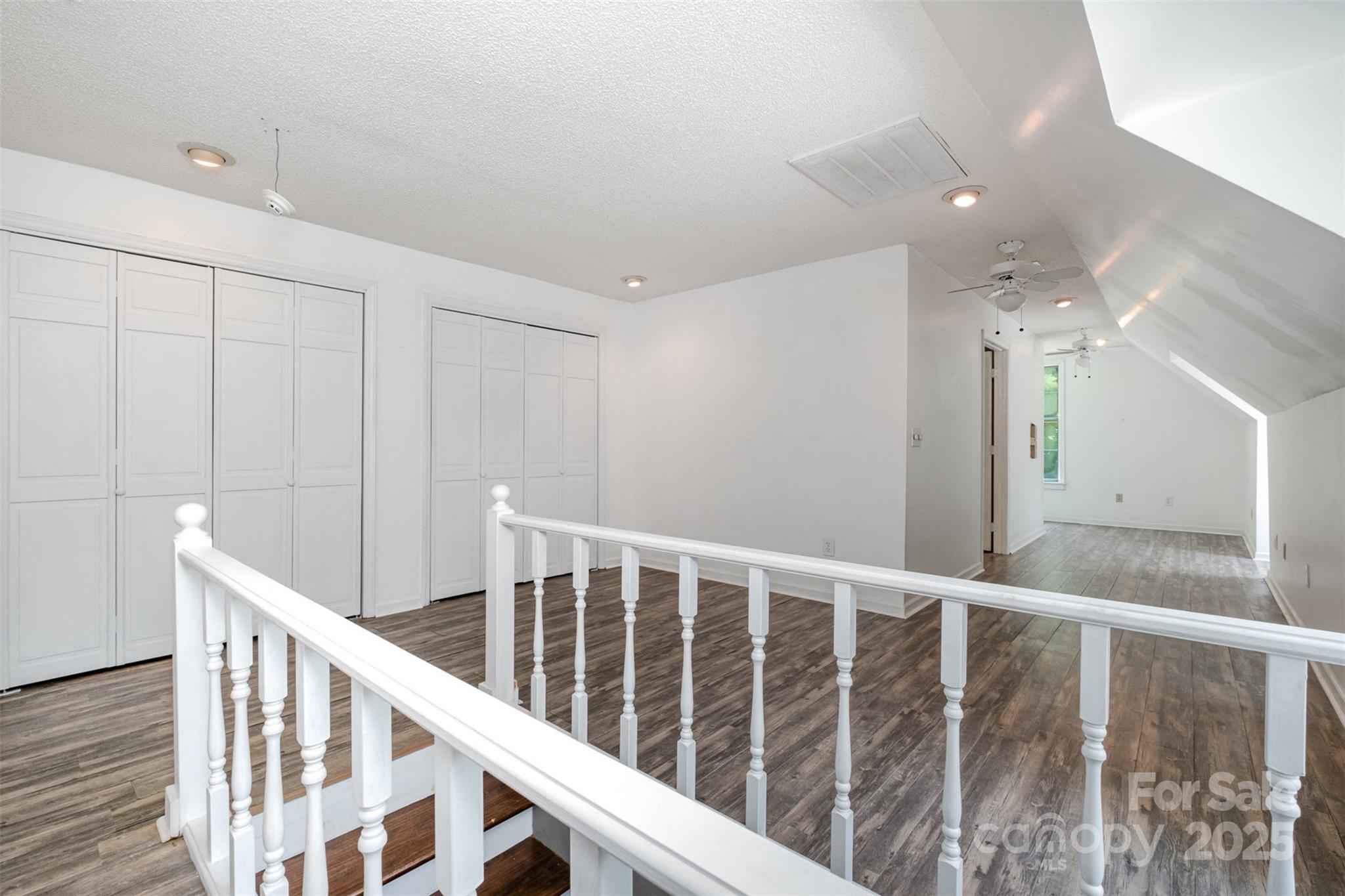 6811 Kluttz Road Concord, NC 28025 - Photo 24 of 38 a view of staircase with railing and white walls