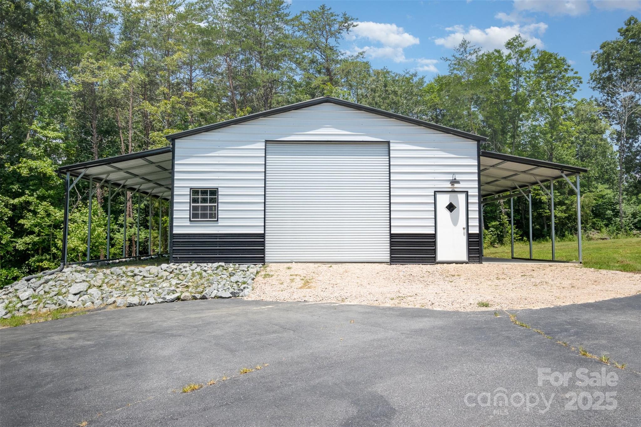 6811 Kluttz Road Concord, NC 28025 - Photo 5 of 38 a white house with a outdoor space