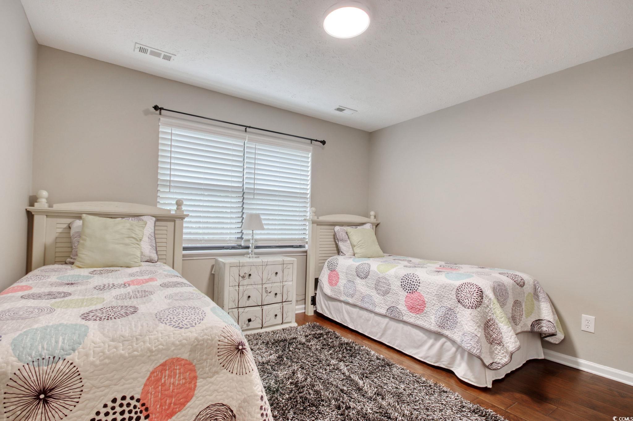 3931 Pinebrook Circle Little River, SC 29566 - Photo 19 of 32 Second bedroom featuring wood flooring and a walk-in closet