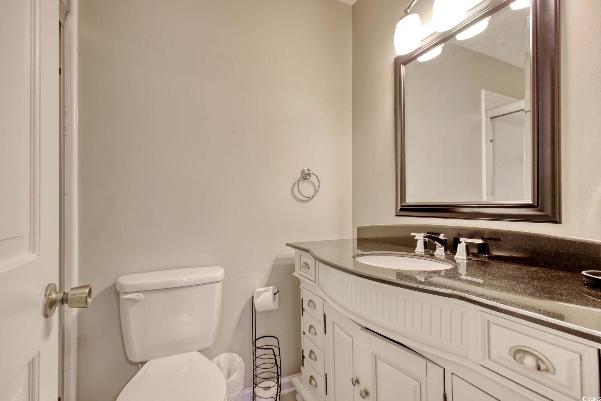3931 Pinebrook Circle Little River, SC 29566 - Photo 26 of 32 Primary bathroom with shower and a vanity with solid surface countertop.