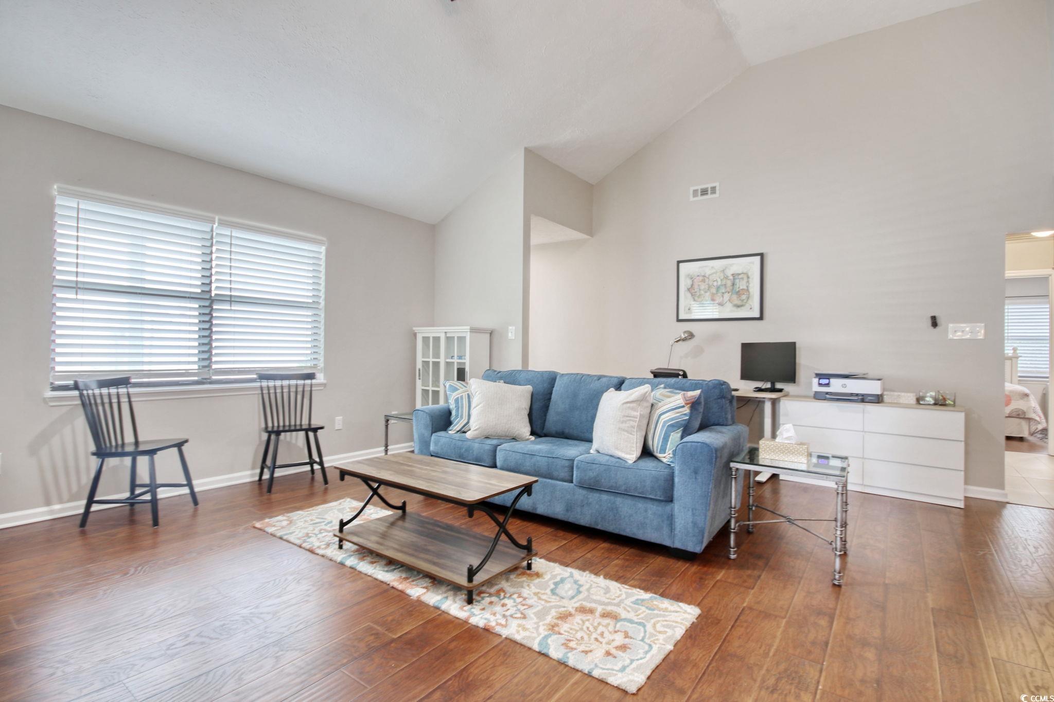 3931 Pinebrook Circle Little River, SC 29566 - Photo 10 of 32 Living room featuring wood flooring and high vaulted ceiling