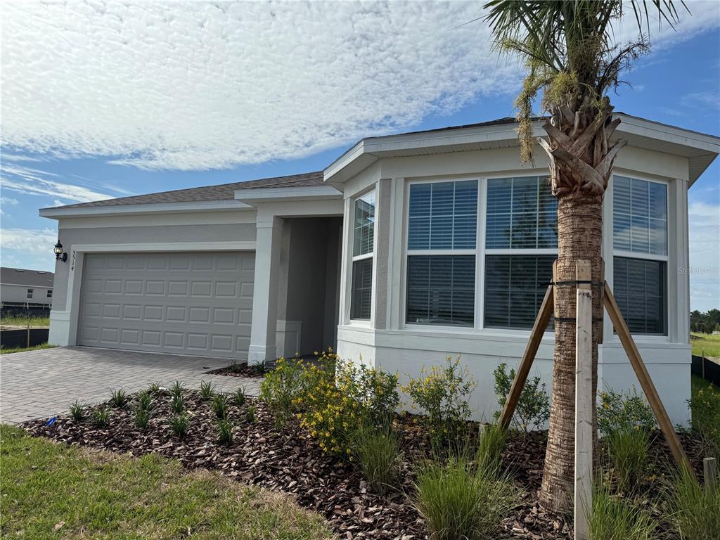 front view of a house with a garden