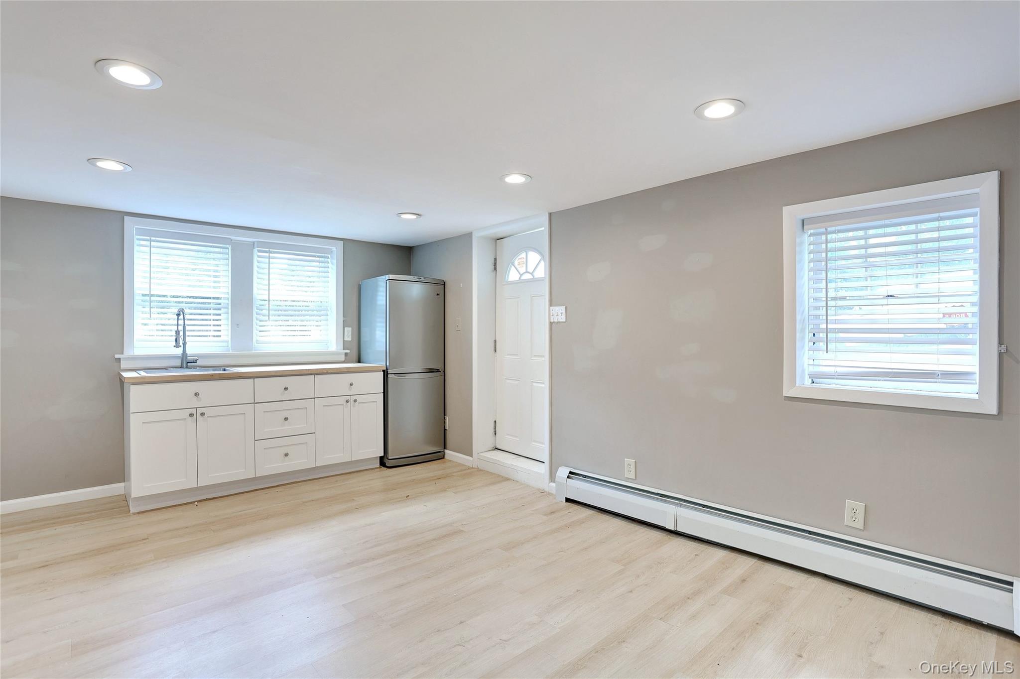 254 North Main Street New City, NY 10956 - Photo 21 of 37 a view of a kitchen with white cabinet and a refrigerator