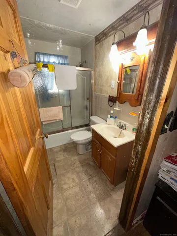a bathroom with a sink vanity and mirror