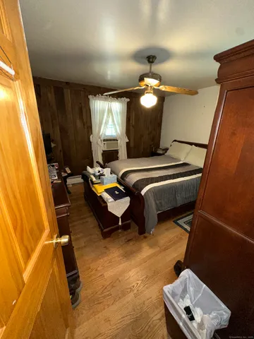 a bedroom with furniture and a window