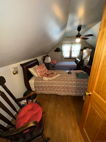 a bed sitting in a room next to a window