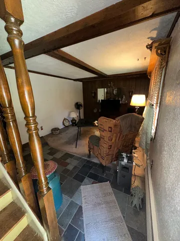 a view of living room with furniture and a window