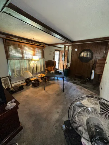 a room with furniture and gym equipment