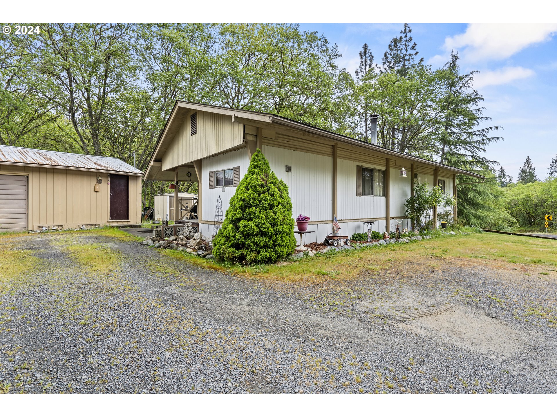 403 Azalea Drive Grants Pass, OR 97526 - Photo 17 of 17 a view of a house with backyard and garden