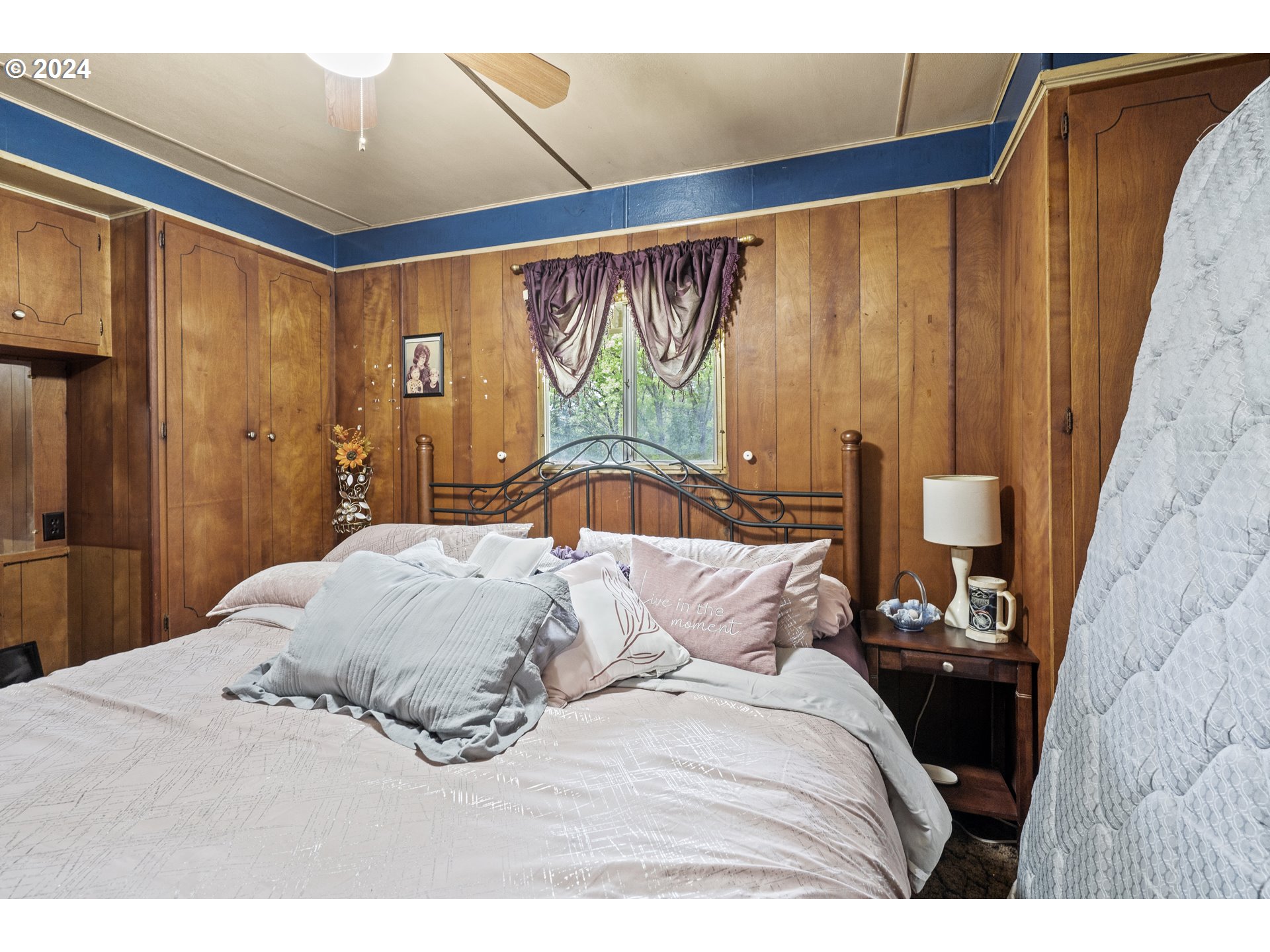 403 Azalea Drive Grants Pass, OR 97526 - Photo 8 of 17 a bedroom with a bed and a painting on the wall