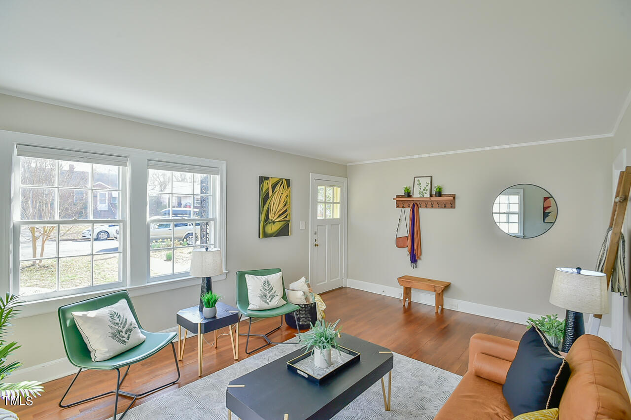 2411 Farthing Street Durham, NC 27704 - Photo 11 of 47 a living room with furniture and wooden floor
