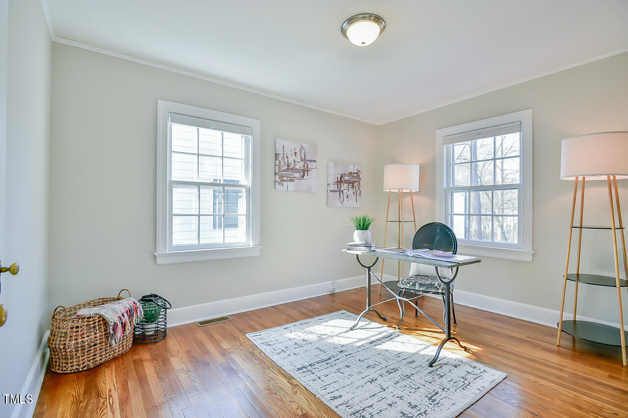 2411 Farthing Street Durham, NC 27704 - Photo 19 of 47 a work room with furniture and wooden floor