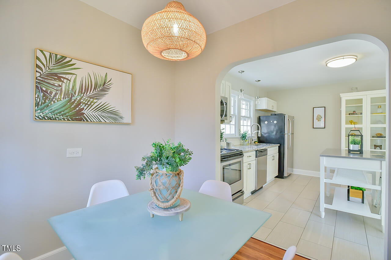 2411 Farthing Street Durham, NC 27704 - Photo 27 of 47 a dining room with furniture and window