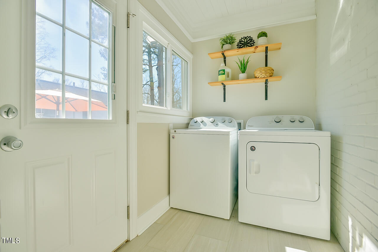 2411 Farthing Street Durham, NC 27704 - Photo 31 of 47 a utility room with dryer and washer