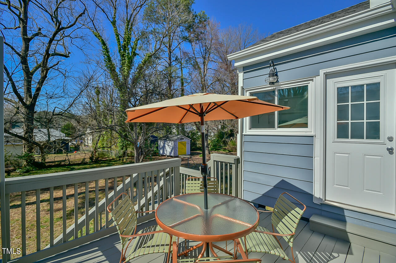 2411 Farthing Street Durham, NC 27704 - Photo 32 of 47 a view of a chair and table on the deck