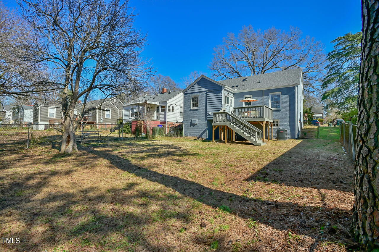 2411 Farthing Street Durham, NC 27704 - Photo 36 of 47 a front view of a house with a yard