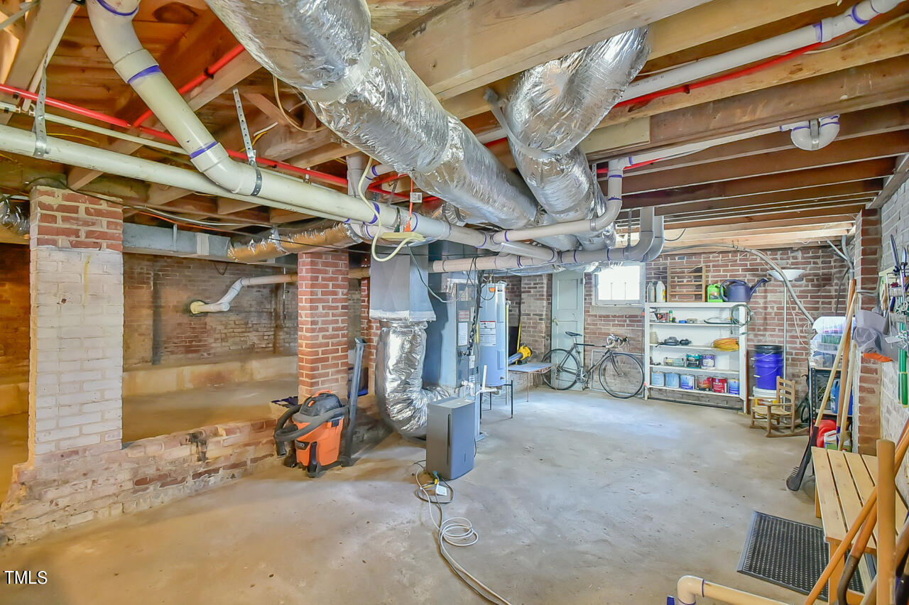 2411 Farthing Street Durham, NC 27704 - Photo 39 of 47 a view of parking garage with cars